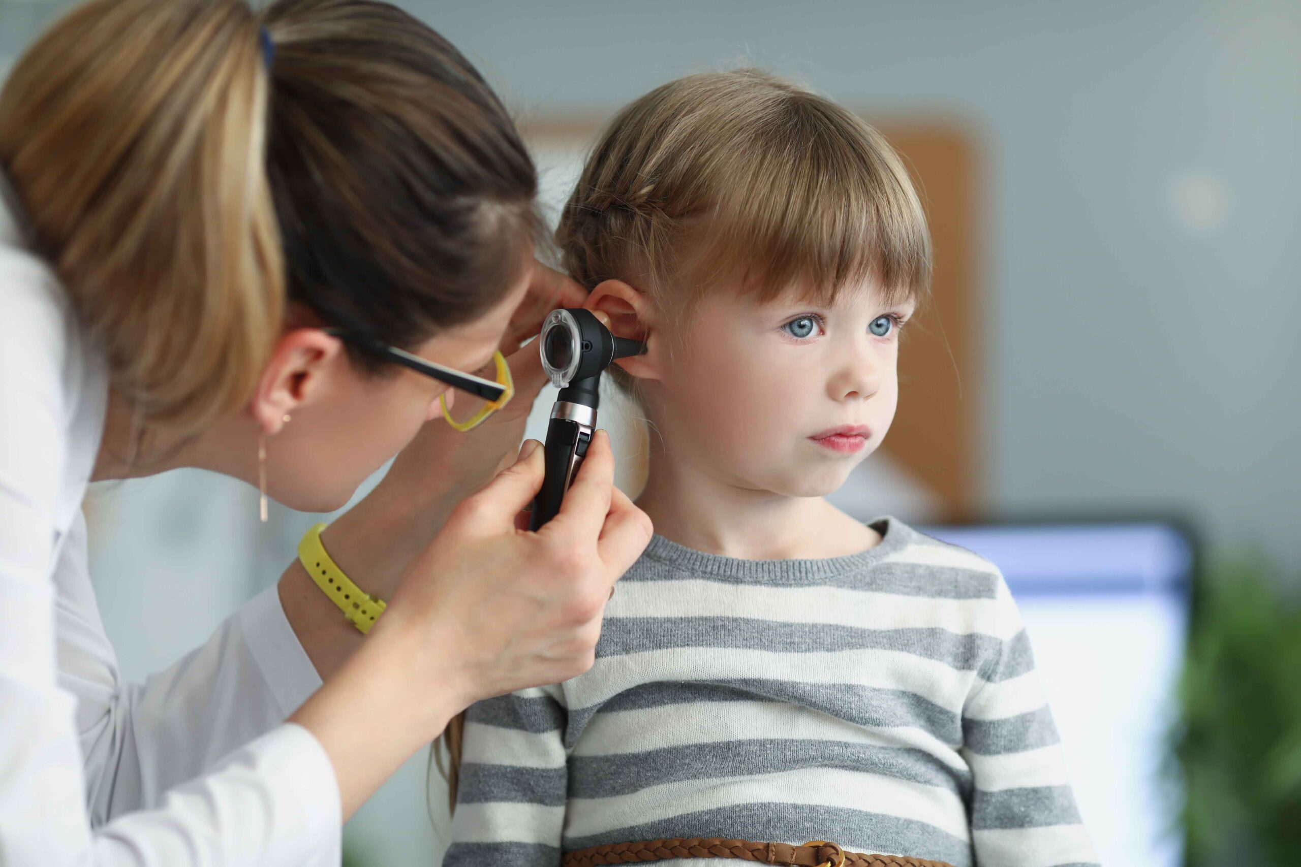 Ear Infections in Children: When to See a Specialist | Home of Healthcare Pediatrician examining a child's ear for signs of infection